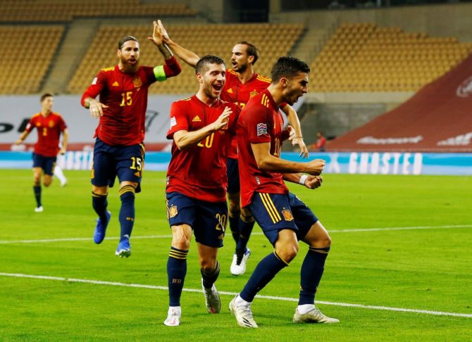 Spain's Ferran Torres celebrates with teammates on scoring their second goal against Germany during their UEFA Nations League - Group D match at Estadio La Cartuja, Seville, on Tuesday