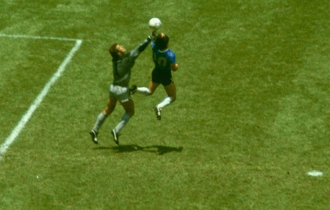 Diego Maradona scores the infamous 'Hand of God' goal past England goalkeeper Peter Shilton during the 1986 FIFA World Cup quarter-final at the Azteca Stadium in Mexico City, on June 22, 1986.  The shirt is set to be auctioned and is likely to fetch a cool US$5million