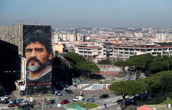 A general view shows a mural by artist Jorit depicting late Argentine soccer legend Diego Maradona, in Naples on Thursday