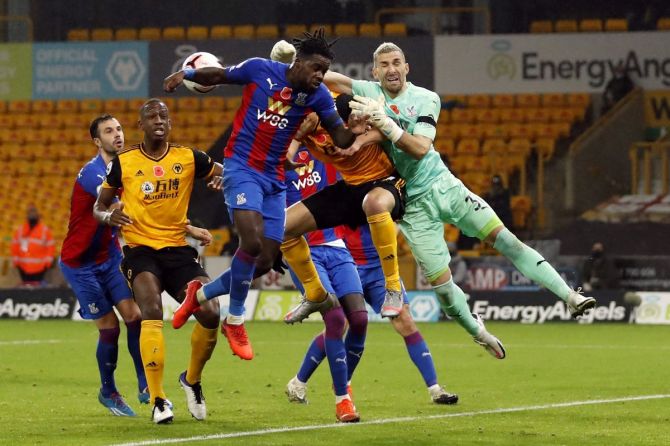 Crystal Palace's Jeffrey Schlupp in action with Wolverhampton Wanderers' Max Kilman on Friday