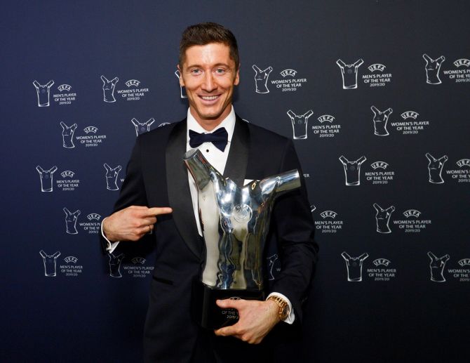 Bayern Munich's Robert Lewandowski poses with the trophy after winning the  UEFA Player of the Year award.