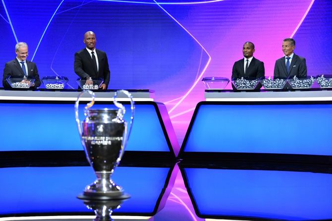 Didier Drogba, Florent Malouda and UEFA General Secretary and Director of Football Giorgio Marchetti at the UEFA Champions League Group Stage draw in Geneva,
