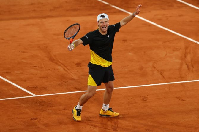 Argentina's Diego Schwartzman celebrates winning his quarter-final against Austria's Dominic Thiem at the French Open, in Paris, on Tuesday.