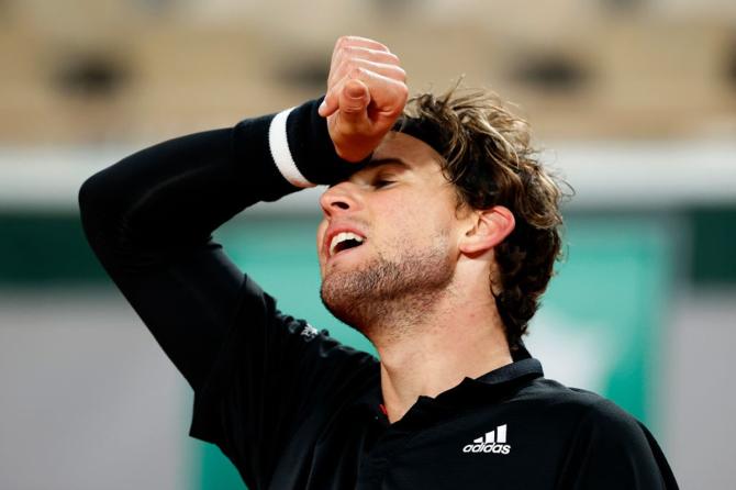 Austria's Dominic Thiem reacts after losing a point.