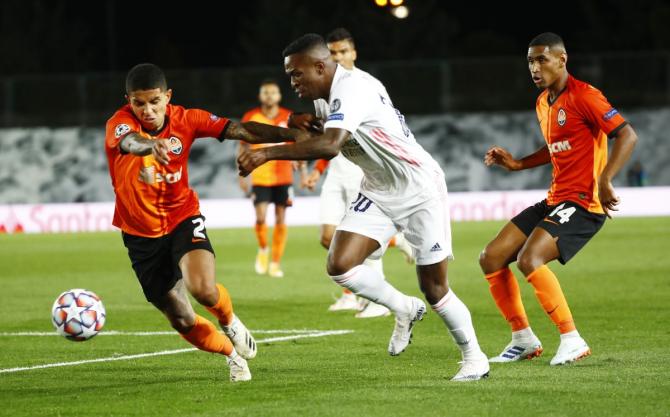 Real Madrid's Vinicius Junior (right) vies for possession 