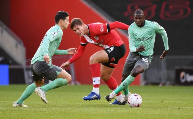 Southampton's Jannik Vestergaard vies with Everton's Abdoulaye Doucoure during their Premier League match at St Mary's Stadium, Southampton on Sunday