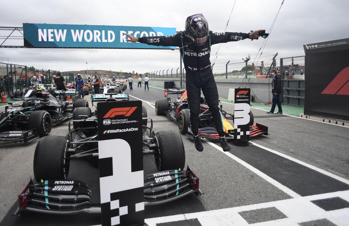 Lewis Hamilton celebrates his win. Hamilton lapped all but the three drivers behind him but it had not looked so simple at the start when he dropped to third from pole position on a lively opening lap with occasional rain complicating matters.