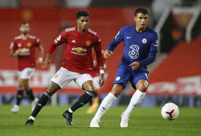 Manchester United's Marcus Rashford and Chelsea's Thiago Silva battle for possession