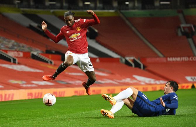 Manchester United's Aaron Wan-Bissaka in action with Chelsea's Ben Chilwell during their match at Old Trafford 