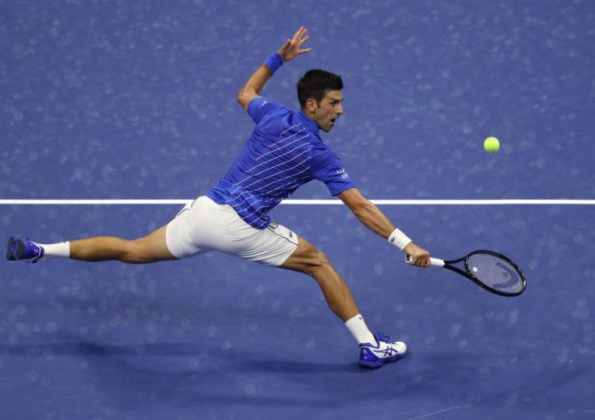 Serbia's Novak Djokovic plays a returns during his US Open first round match against Bosnia and Herzegovina's Damir Dzumhur on Monday