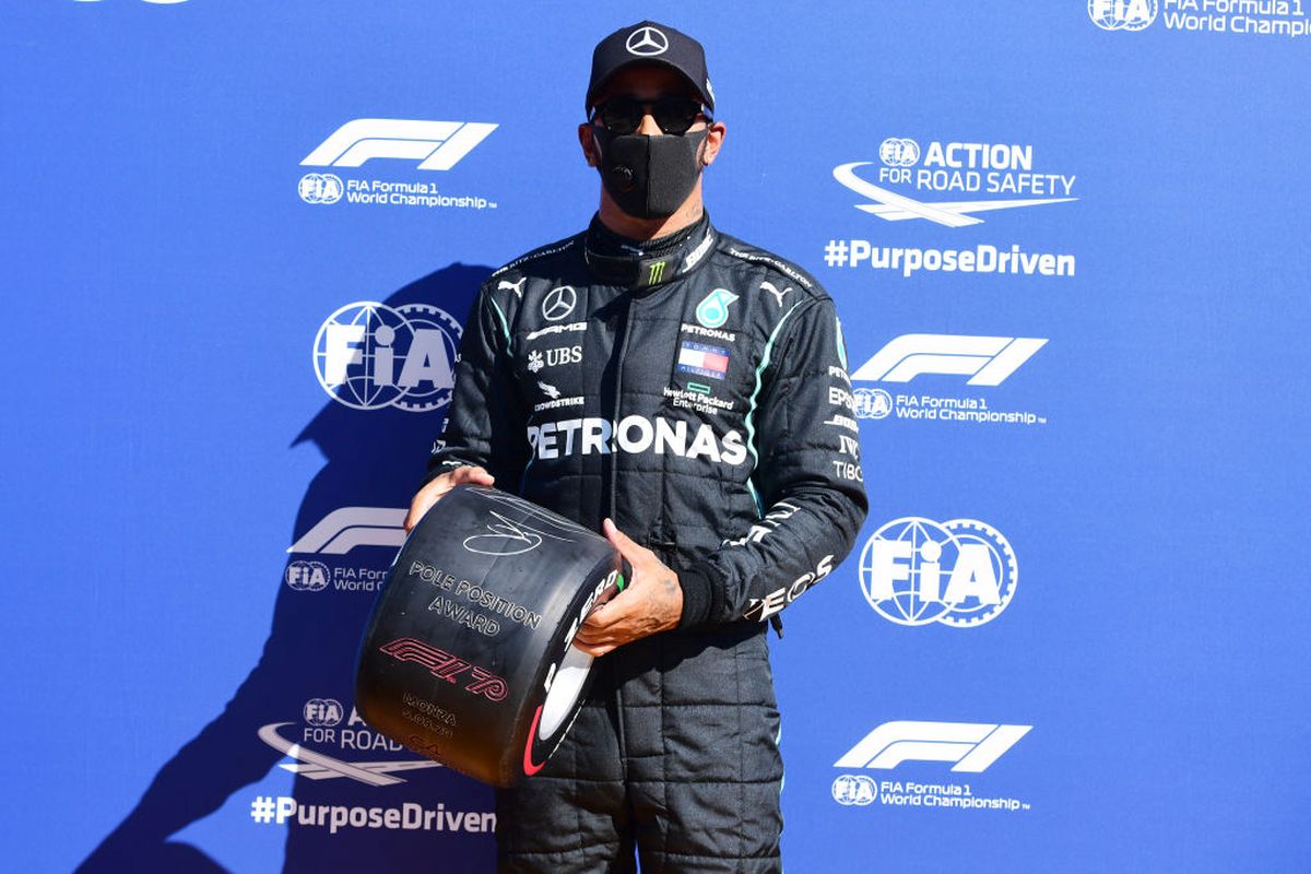 Pole position qualifier Great Britain and Mercedes GP's Lewis Hamilton celebrates in parc ferme during qualifying for the F1 Grand Prix of Italy at Autodromo di Monza in Monza, Italy, on Saturday