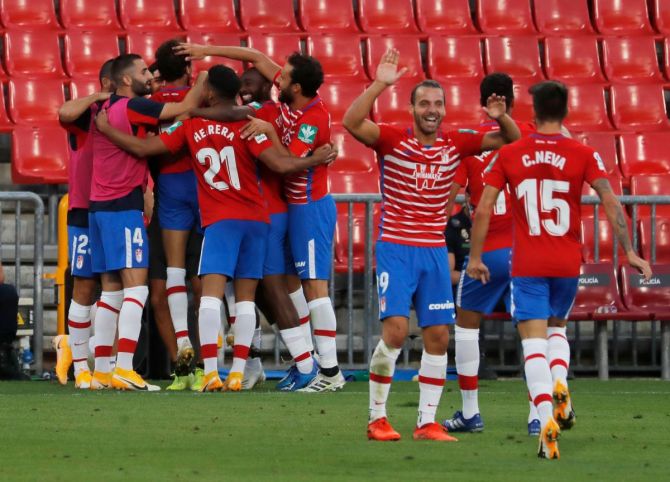 Granada's Luis Milla celebrates with teammates after scoring their second goal against Athletic Bilboa at Nuevo Estadio de Los Carmenes, Granada, Spain, on Saturday