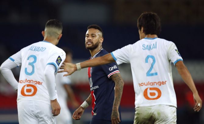 Paris St Germain's Neymar clashes with Olympique de Marseille's Alvaro Gonzalez during their Ligue 1 match at Parc des Princes in Paris on Sunday