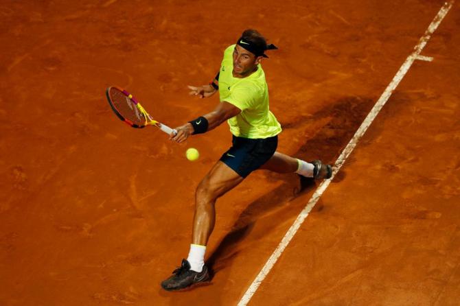 Spain's Rafael Nadal stretches to play a backhand in his second round match against compatriot Pablo Carreno Busta on day three of the Internazionali BNL d'Italia at Foro Italico in Rome on Wednesday