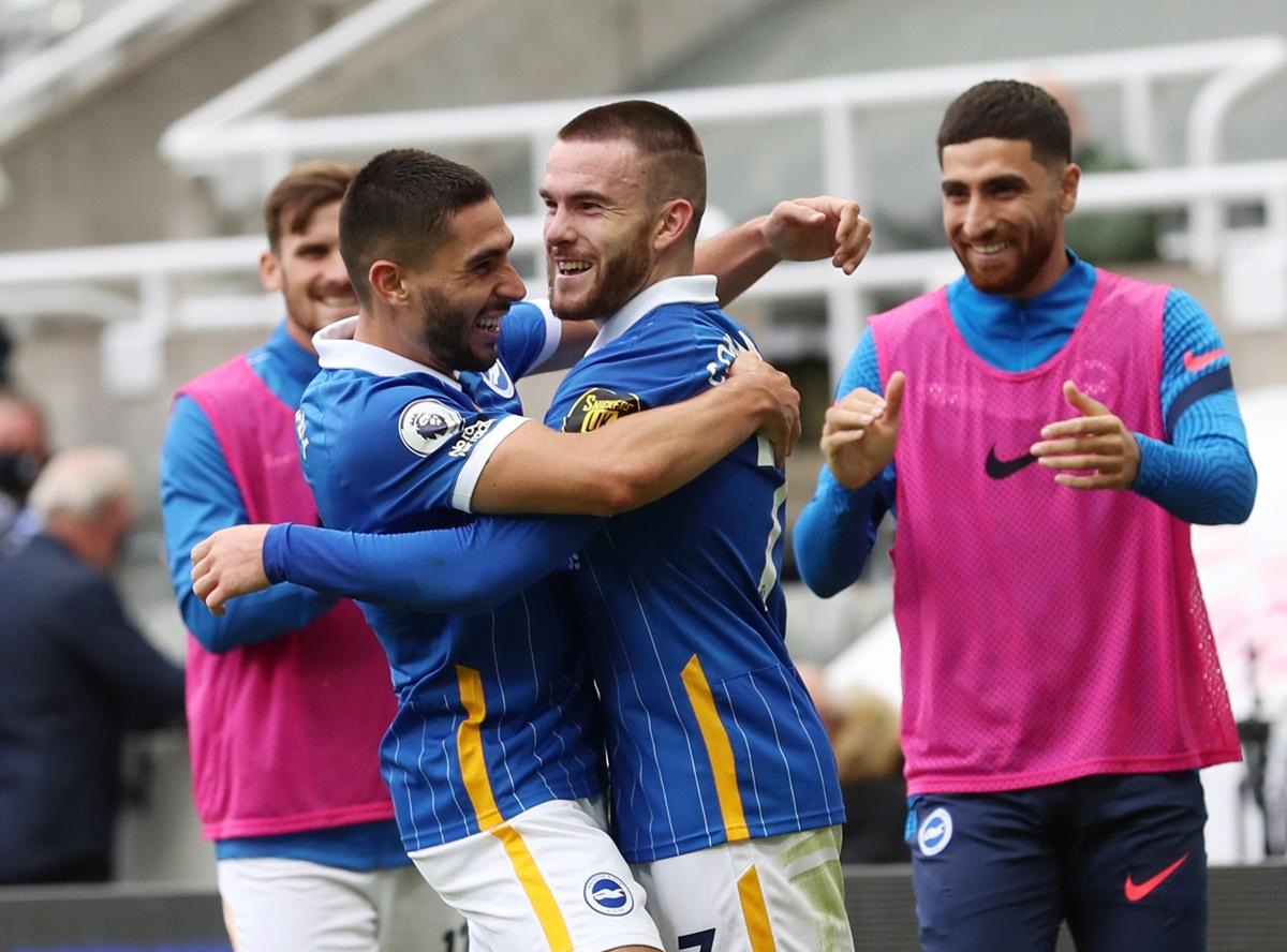 Aaron Connolly celebrates scoring Brighton & Hove Albion's third goal with Neal Maupay.