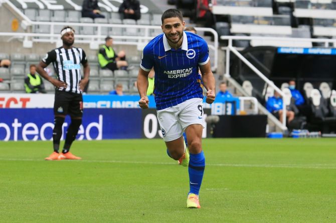 Neal Maupay celebrates scoring Brighton & Hove Albion's first goal from the penalty spot.