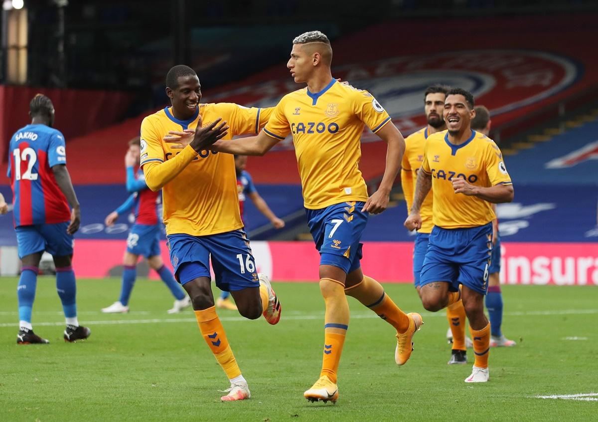 Everton's Richarlison, right, celebrates with Abdoulaye Doucoure after scoring from the penalty spot