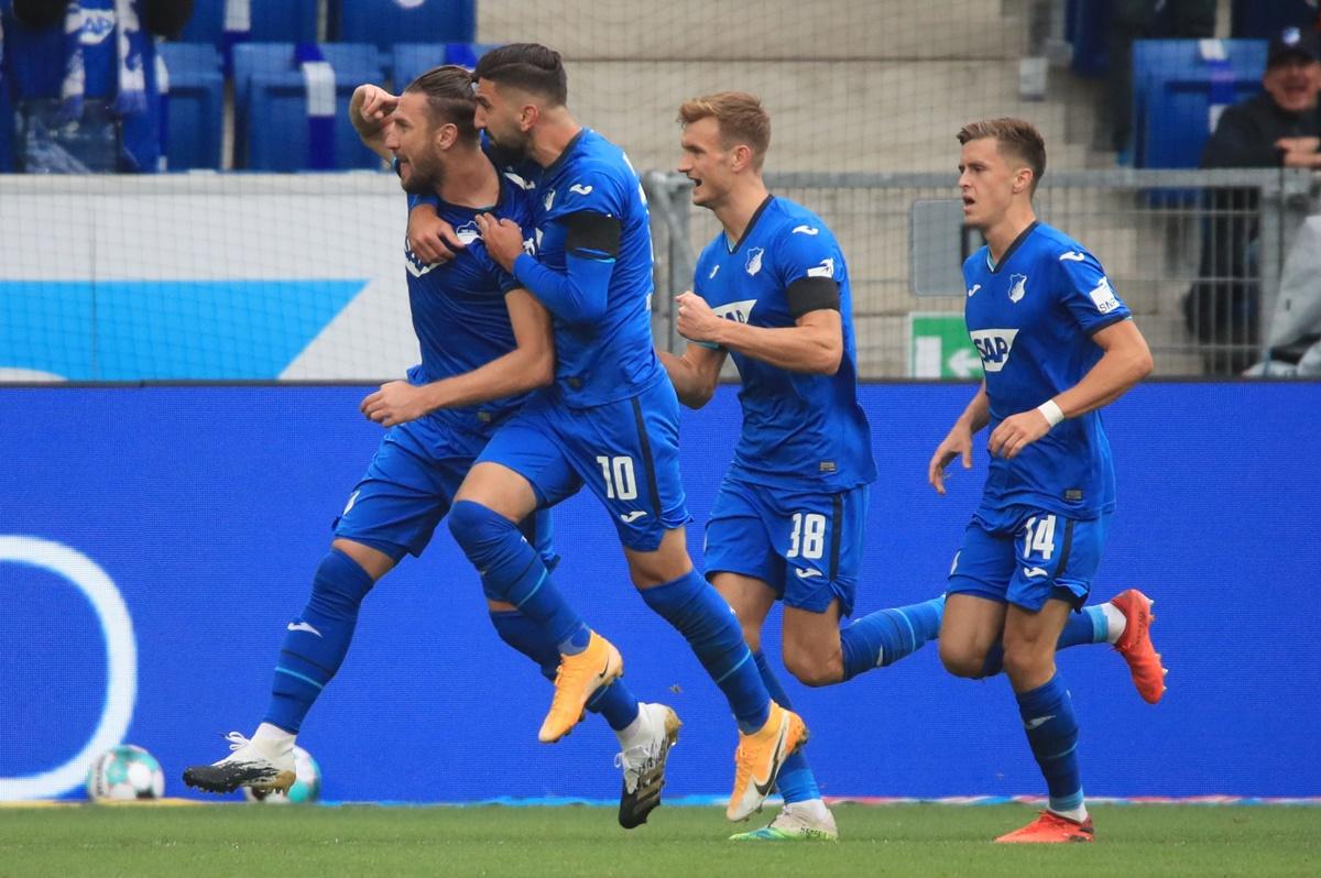 Ermin Bicakcic celebrates scoring TSG 1899 Hoffenheim's first goal with teammates during the Bundesliga match against Bayern Munich, at PreZero Arena, Sinsheim, Germany, on Sunday.