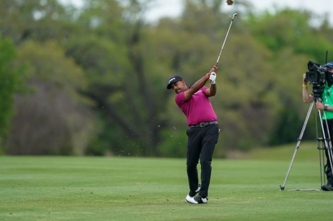 Anirban Lahiri hits his second shot on hole 9 during the third round of the Valero Texas Open golf tournament at San Antonio, Texas, USA, on Saturday, April 3.  Lahiri had missed five cuts in his last six starts and his finish in Texas gave him a much-needed boost in the FedExCup standings, lifting him to 94th from 125th.