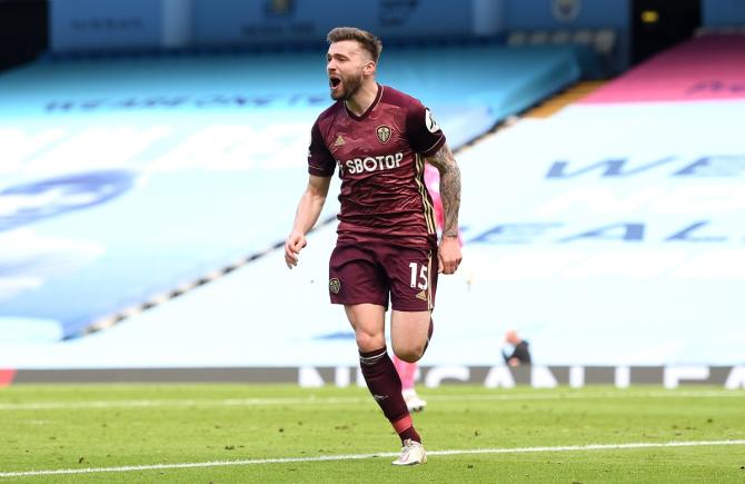 Stuart Dallas celebrates after scoring the match-winner for Leeds United in stoppage time. 