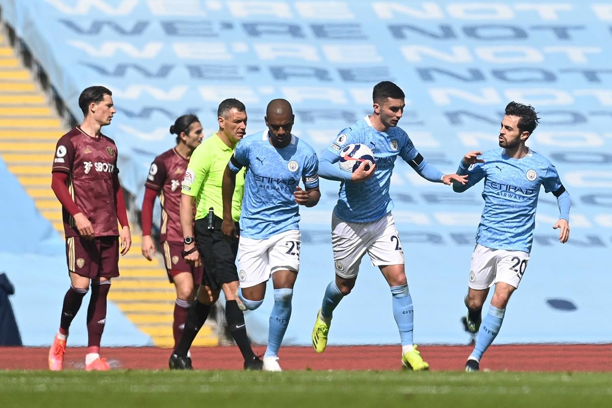 Ferran Torres celebrates with Bernardo Silva after restoring parity for Manchester City. 