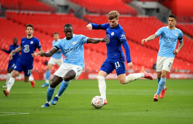 Manchester City's Benjamin Mendy and Chelsea's Timo Werner battle for posession