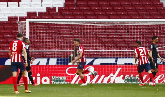 Atletico Madrid's Marcos Llorente celebrates scoring their fourth goal against Eibar 