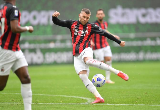 AC Milan's Ante Rebic scores their first goal against Genoa 