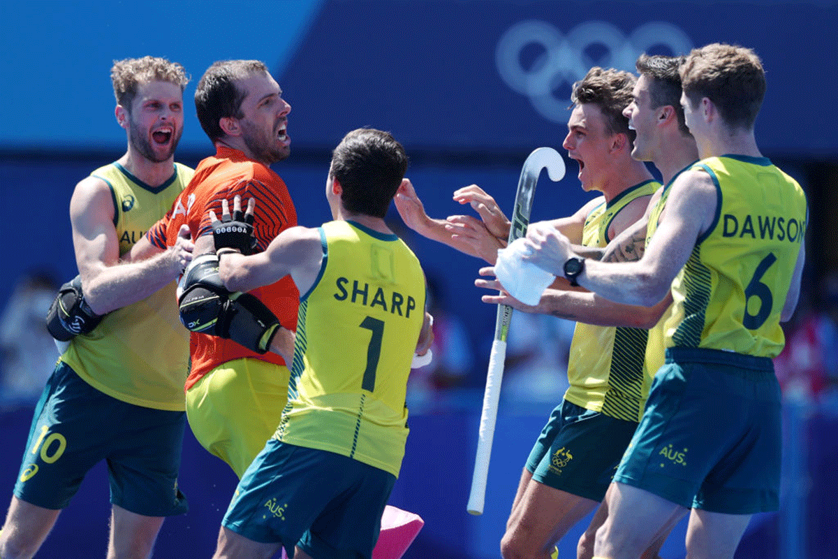 Australia's Andrew Lewis Charter, Joshua Beltz, Lachlan Thomas Sharp and Matthew Dawson celebrate after winning the penalty shootout to beat Netherland's in the men's hockey quarterfinal of the Tokyo 2020 Olympic Games at Oi Hockey Stadium in Tokyo, on Sunday