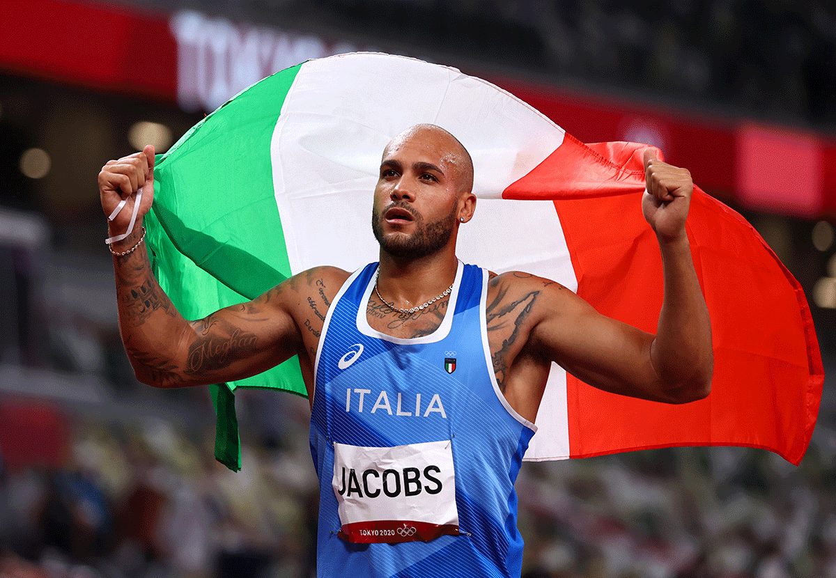 Lamont Marcell Jacobs of Italy celebrates after winning gold