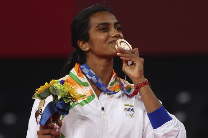 India's Pusarla V Sindhu poses with her women's singles badminton bronze medal after the medal ceremony, at Forest Sport Plaza, Tokyo, on Sunday.