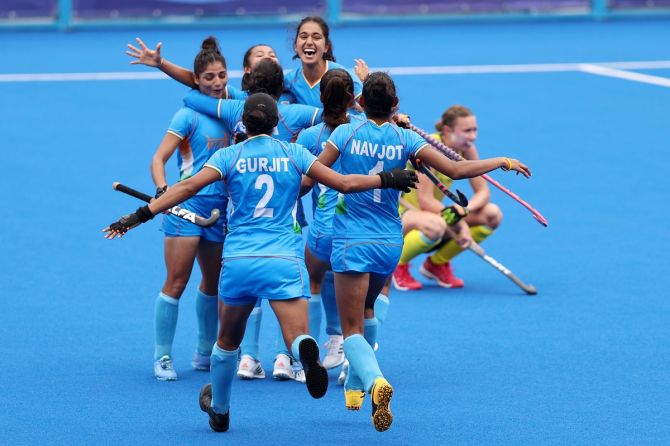 India's players rejoice after their 1-0 victory over Australia in the Olympics women's hockey quarter-final, at Oi Hockey stadium, on Monday.