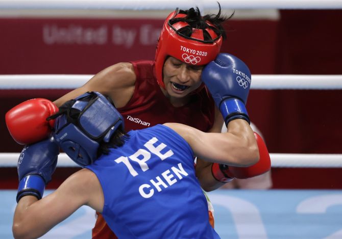 India's Lovlina Borgohain trades punches with Taiwan's Chen Nien-Chin during her Olympics women's welterweight boxing quarter-final
