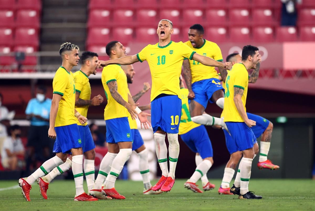 Richarlison and teammates celebrate after Brazil score during the penalty shoot-out against Mexico, in the Olympics men's football semi-final, at Ibaraki Kashima Stadium, in Ibaraki Japan, on Tuesday