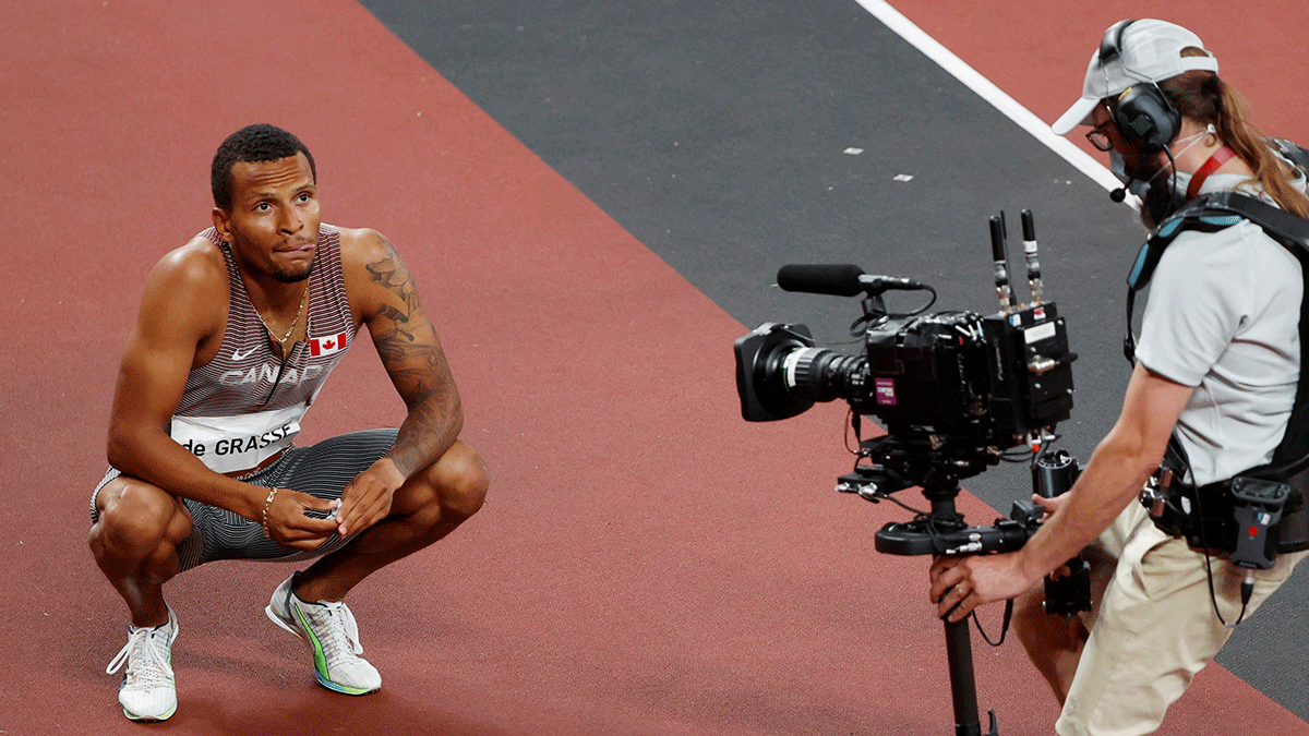 Canada's Andre De Grasse reacts after finishing first in Heat 3 of the 200m Men's semi-final at Olympic Stadium in Tokyo on Tuesday 