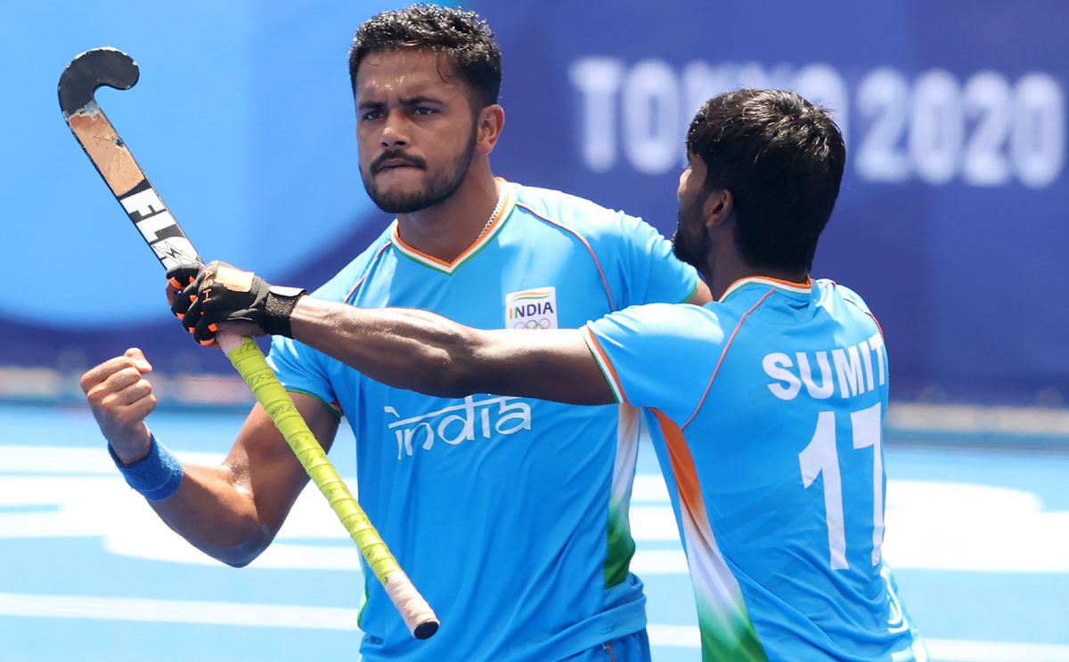 Harmanpreet Singh celebrates with Sumit after scoring India's first goal during the Olympics men's hockey semi-final against Belgium, at Oi Hockey Stadium in Tokyo, on Tuesday