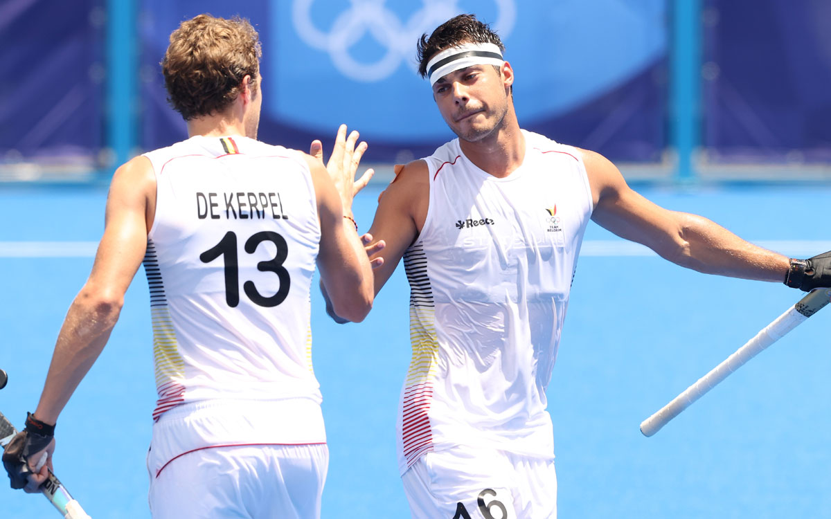 Alexander Hendrickx celebrates with with Nicolas de Kerpel after scoring Belgium's third goal.