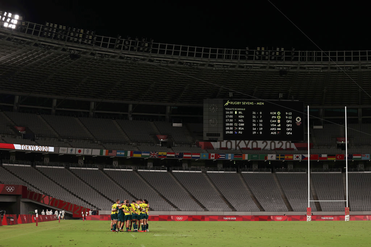 Australia's Rugby Sevens Men's team in a huddle after their quarter-final loss to Fiji at the Tokyo Olympic Games at Tokyo Stadium on July 27. Rugby Australia said on Tuesday it had launched its own investigation after being informed by Australian team officials of "unacceptable" behaviour by rugby and football players on the flight home from the Olympics.