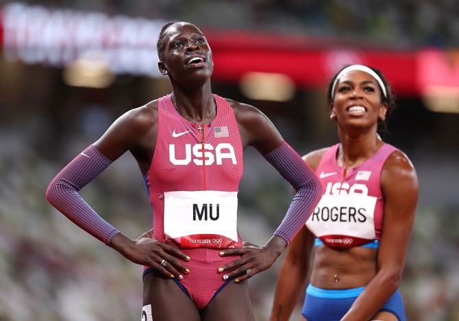 Athing Mu of the United States reacts after crossing the line first to win gold in the Olympics women's 800 metres. Compatriot Raevyn Rogers, right, won bronze.