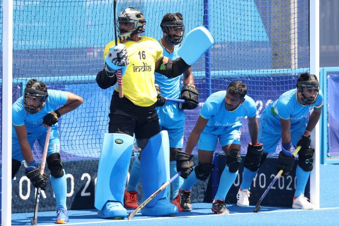 India's goalkeeper P R Sreejesh and teammates prepare to defend the goal following a penalty-corner in the Olympics men's hockey semi-final against Belgium on Tuesday. 