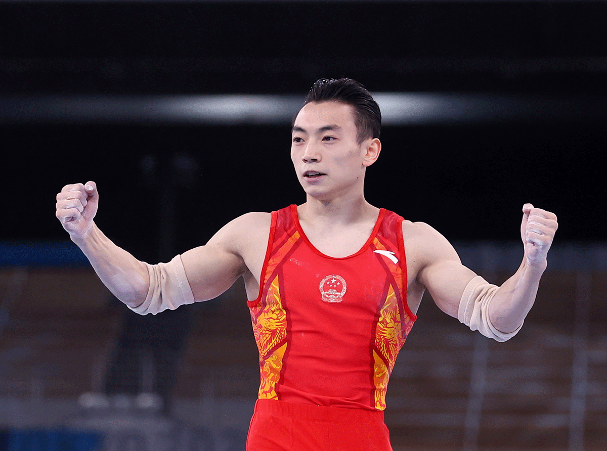China's Zou Jingyuan reacts after competing in the Artistic Men's Parallel Bars Final on Tuesday 