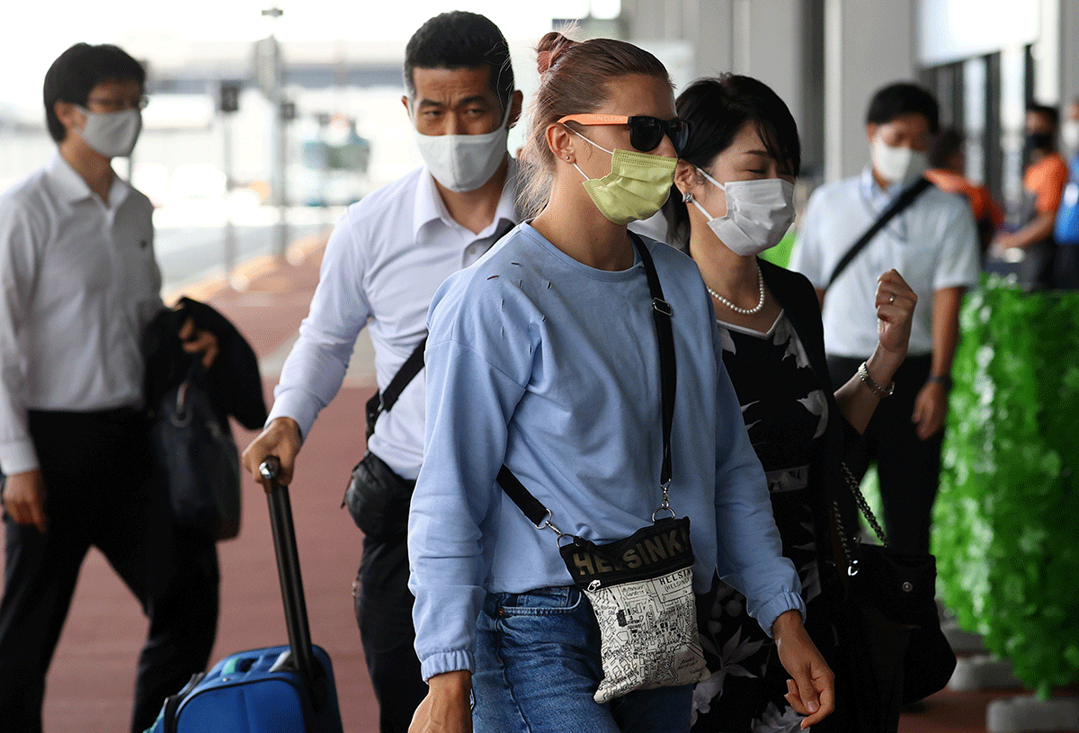 Belarusian Sprinter Krystsina Tsimanouskaya who took refuge in the Polish embassy in Tokyo, arrives at Narita International Airport to leave for Vienna on Wednesday