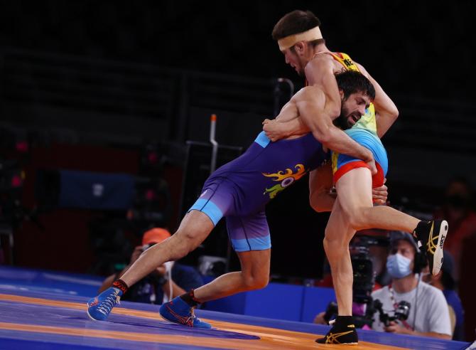 India's Ravi Kumar Dahiya in action against Kazakhstan's Nurislam Sanayev.