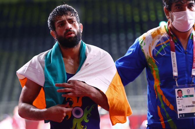 India's Ravi Kumar Dahiya reacts after winning his Olympics men's 57kg Freestyle wrestling bout against Kazakhstan's Nurislam Sanayev on Wednesday