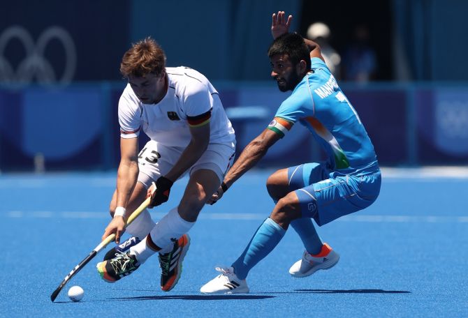 India's Manpreet Singh tackles Germany's Jan Christopher Ruhr during the Olympics men's bronze medal match against Germany, at Oi Hockey Stadium in Tokyo, on Thursday