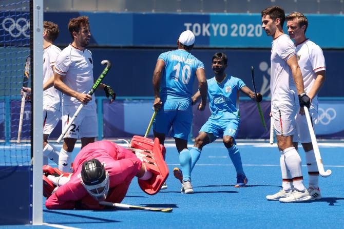 Simranjeet Singh celebrates scoring India's fifth goal.