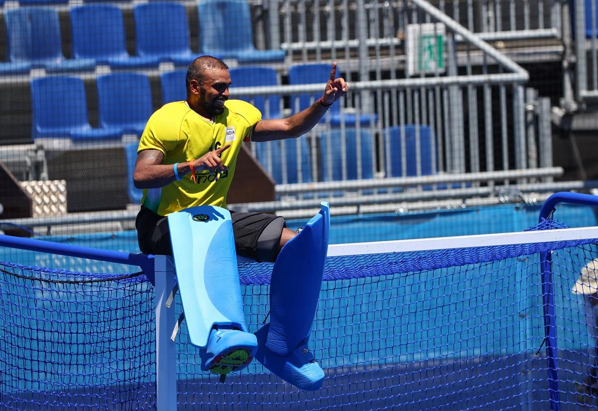 India's goalkeeper P R Sreejesh celebrates on top of the goalpost after victory over Germany in the Olympics men's hockey bronze medal pay- off, at Oi Hockey Stadium, in Tokyo, on Thursday. 