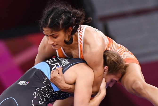 India's Vinesh Phogat, right, in action against Belarus's Vanesa Kaladzinskaya during the Olympics women's 53kg Freestyle quarter-finals at the Tokyo Olympics  