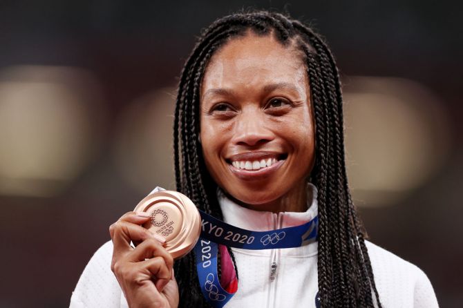 Bronze medalist Allyson Felix of the United States holds her medal on the podium.