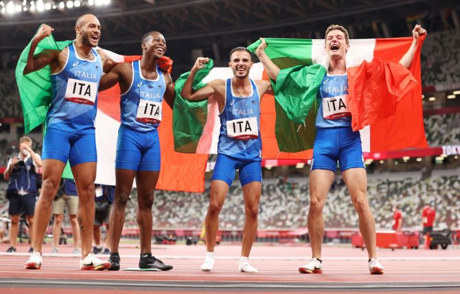 Italy's Lorenzo Patta, Lamont Marcell Jacobs, Eseosa Fostine Desalu and Filippo Tortu celebrate winning the gold medal in the Olympics men's 4 x 100m Relay Final, at Olympic Stadium in Tokyo, on Friday. 